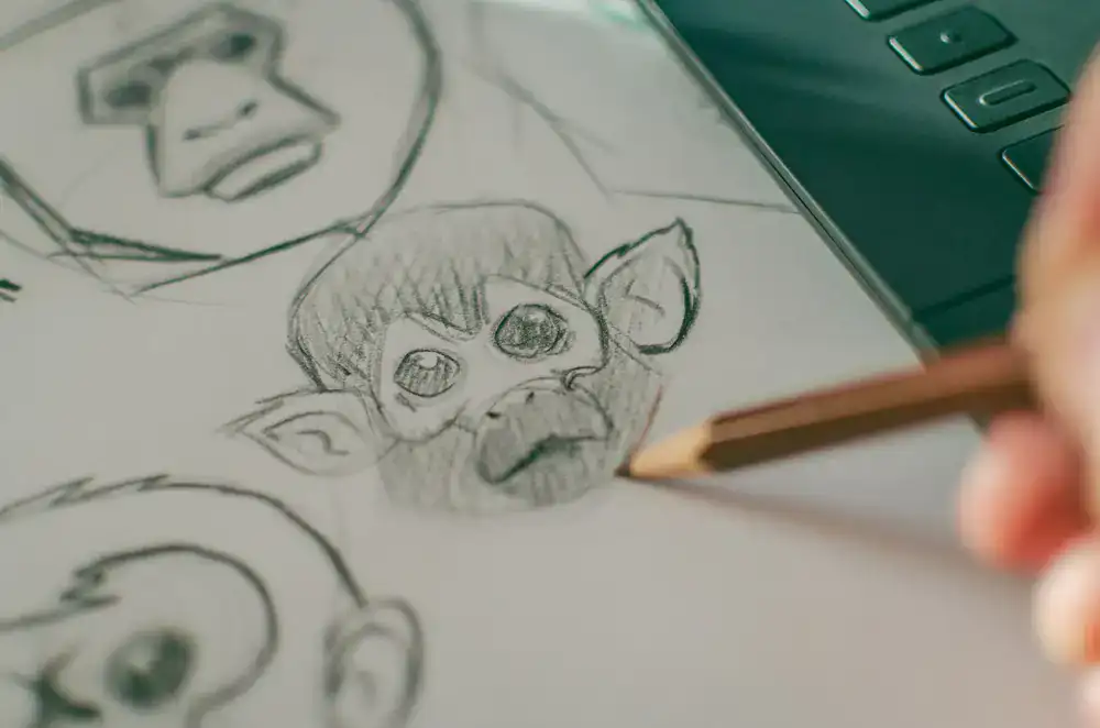 Game design team at Bigcatch Games sketching colorful fish characters