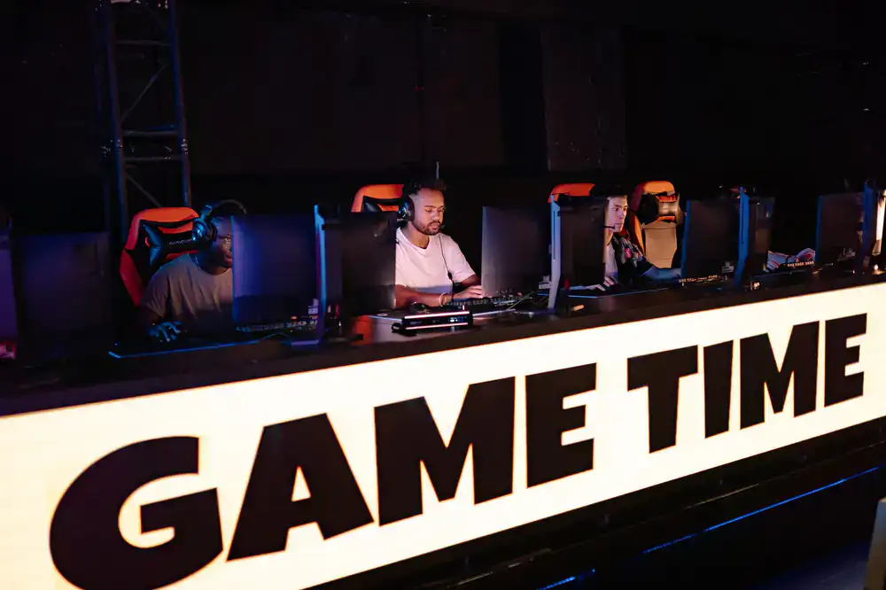 Bigcatch Games support team reviewing gameplay footage in the studio